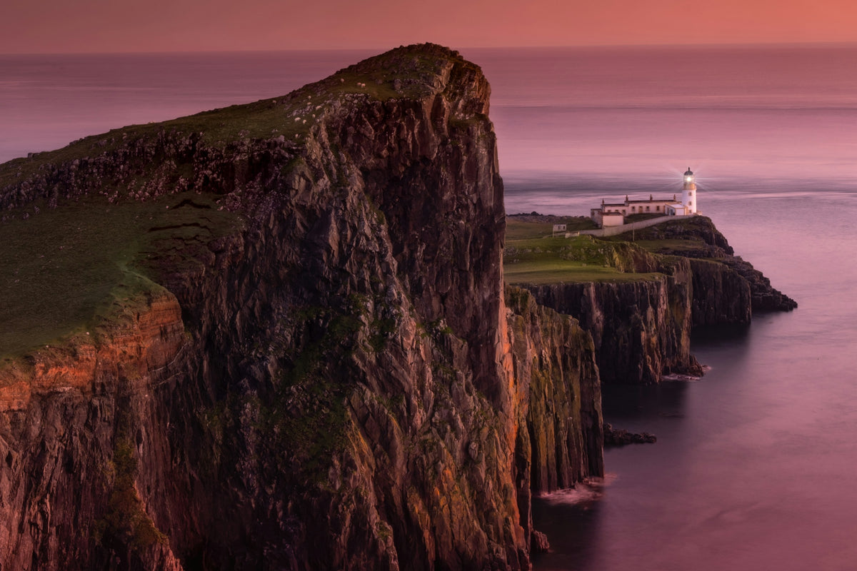 Coastal cliffs and lighthouse on the Isle of Skye