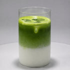 Iced Okumidori matcha latte in a clear glass